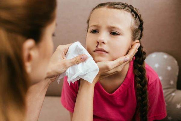 A child suffering from nosebleeds