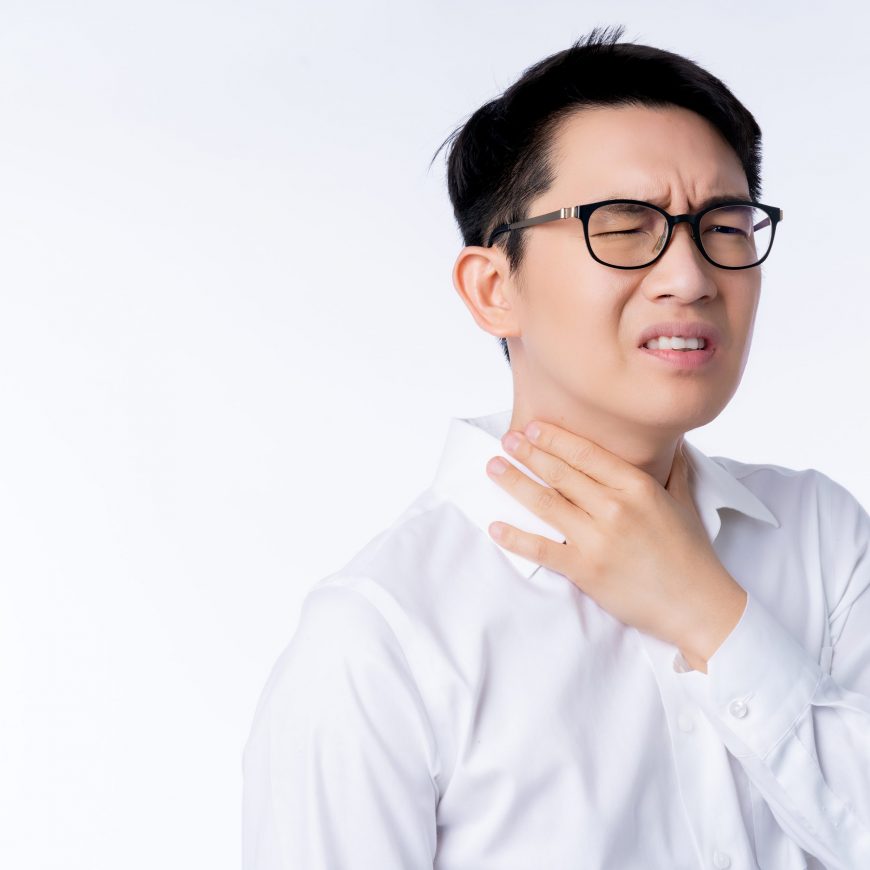 sick asian glasses male adult sore throat pain hand touch neck with stressful and tension white background health ideas concept